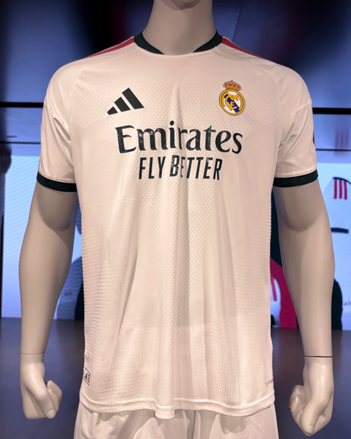 White Real Madrid 2026/27 home shirt on a mannequin in a store display